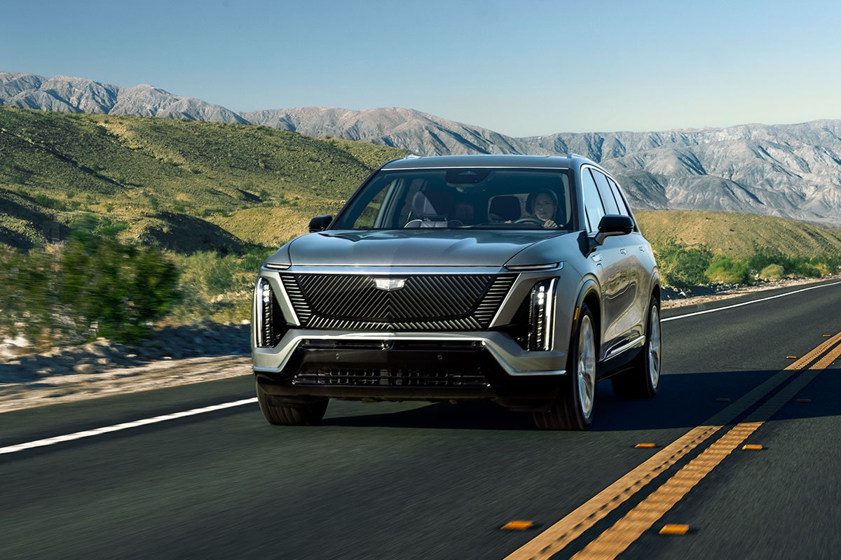 The Cadillac VISTIQ Driving Through the Grassy Mountains