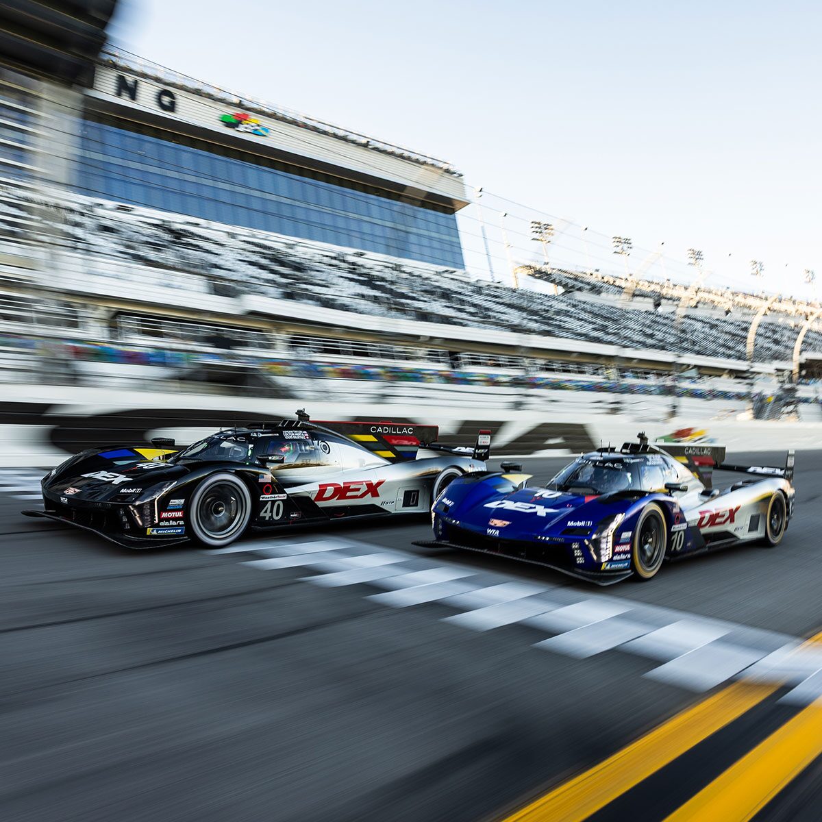 Front View of the Pink Cadillac V-Series.R Racecar Parked on a Race Track