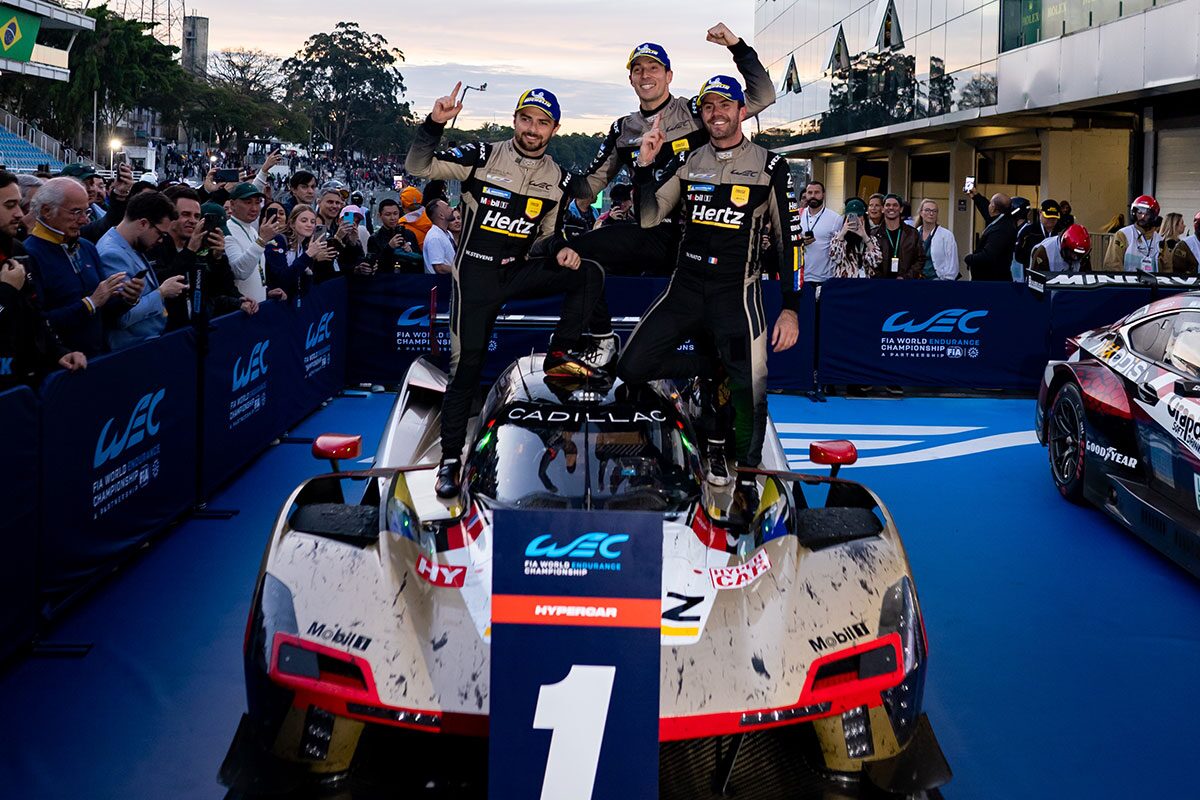 Front View of a Cadillac Race Car and the Cadillac Race Car Drivers