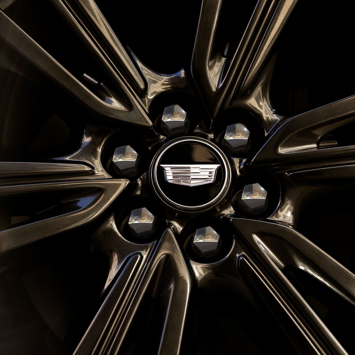Close-up of the Cadillac Logo on the Middle of a Wheel Rim