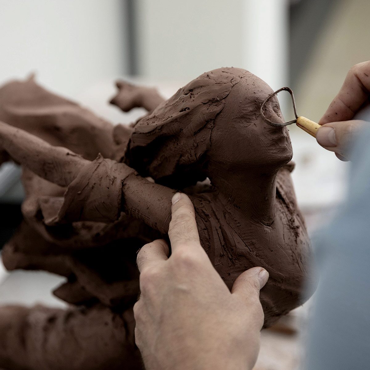 Face Of The Cadillac Hood Ornament Sculpted Out Of Clay