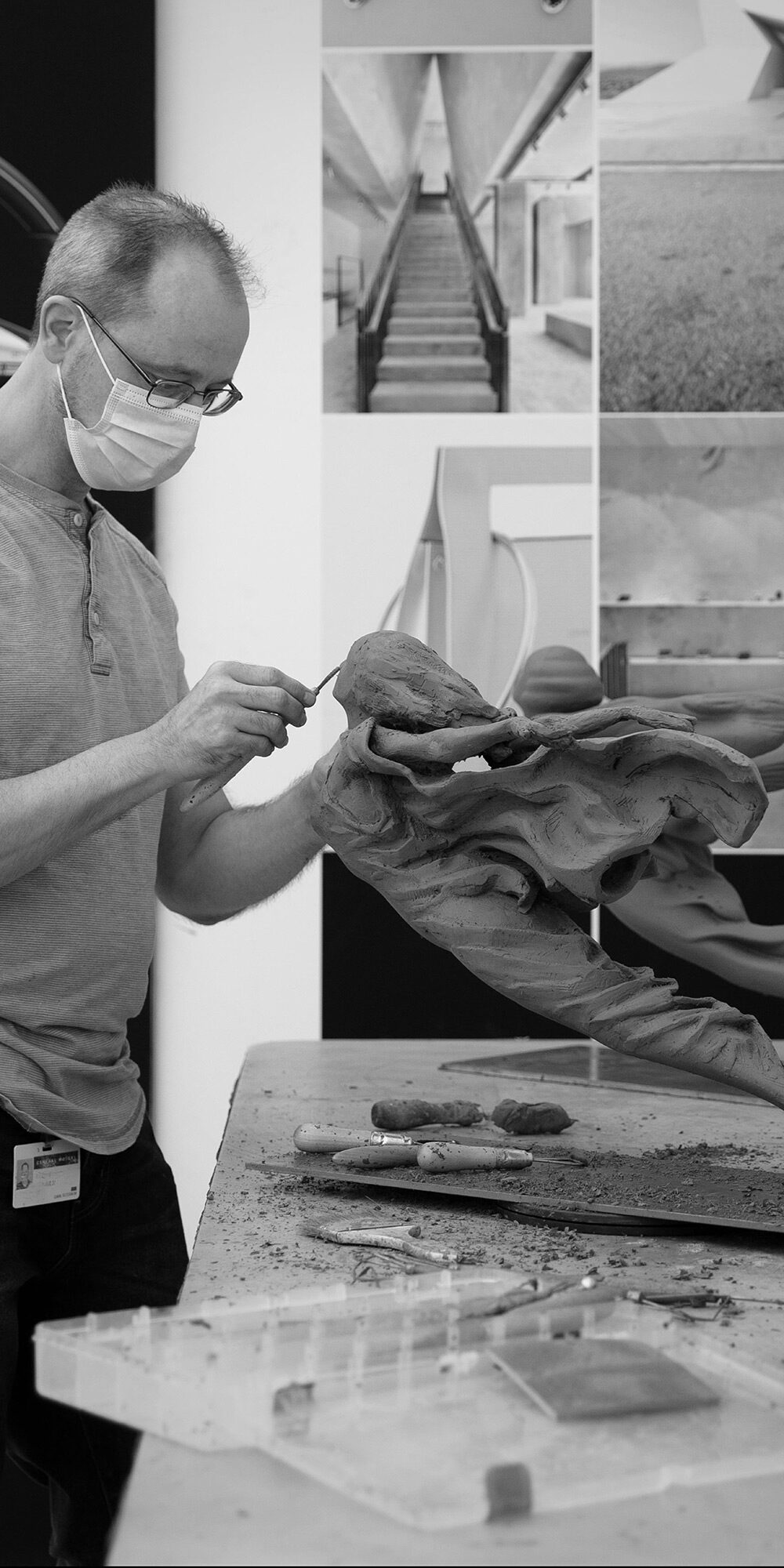 Man Carving The Cadillac Hood Ornament Out Of Clay