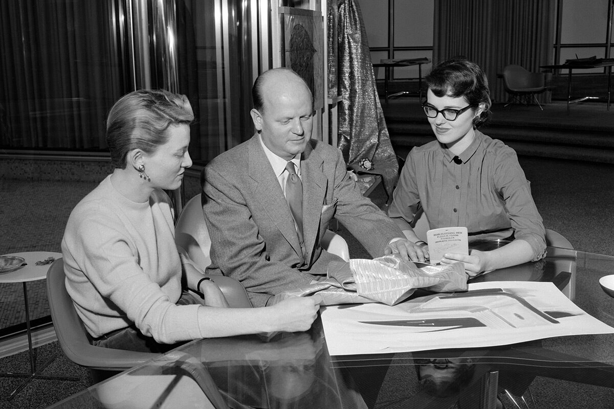Peggy Sauer, Bill Mitchell and Dagmar Arnold reviewing fabrics, 9/27/1956