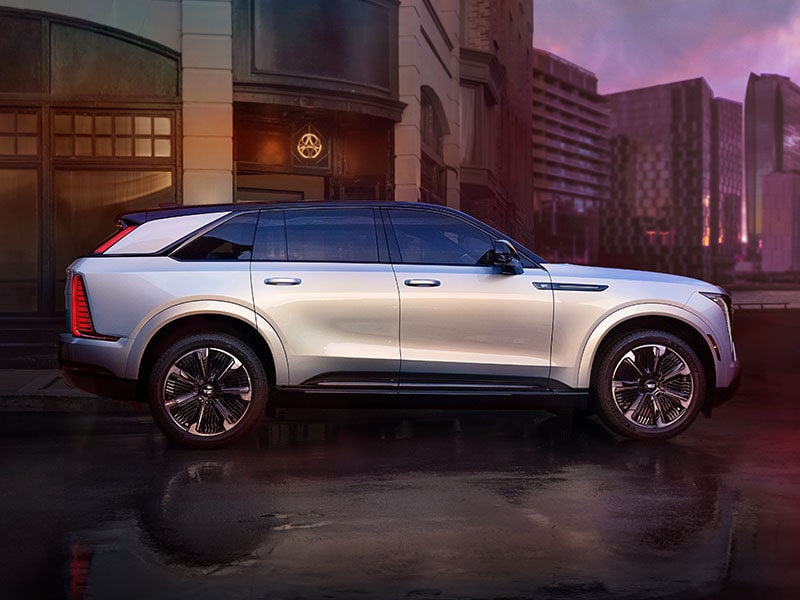 Side Profile of the 2025 Cadillac Escalade IQ Parked Downtown