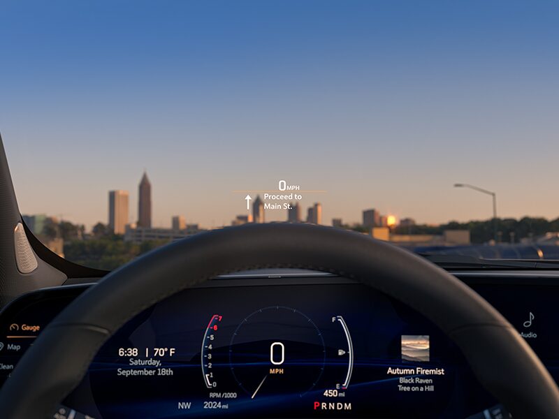 Close-up of the 2025 Cadillac XT4 Head-up Display on Windshield Outlooking the City