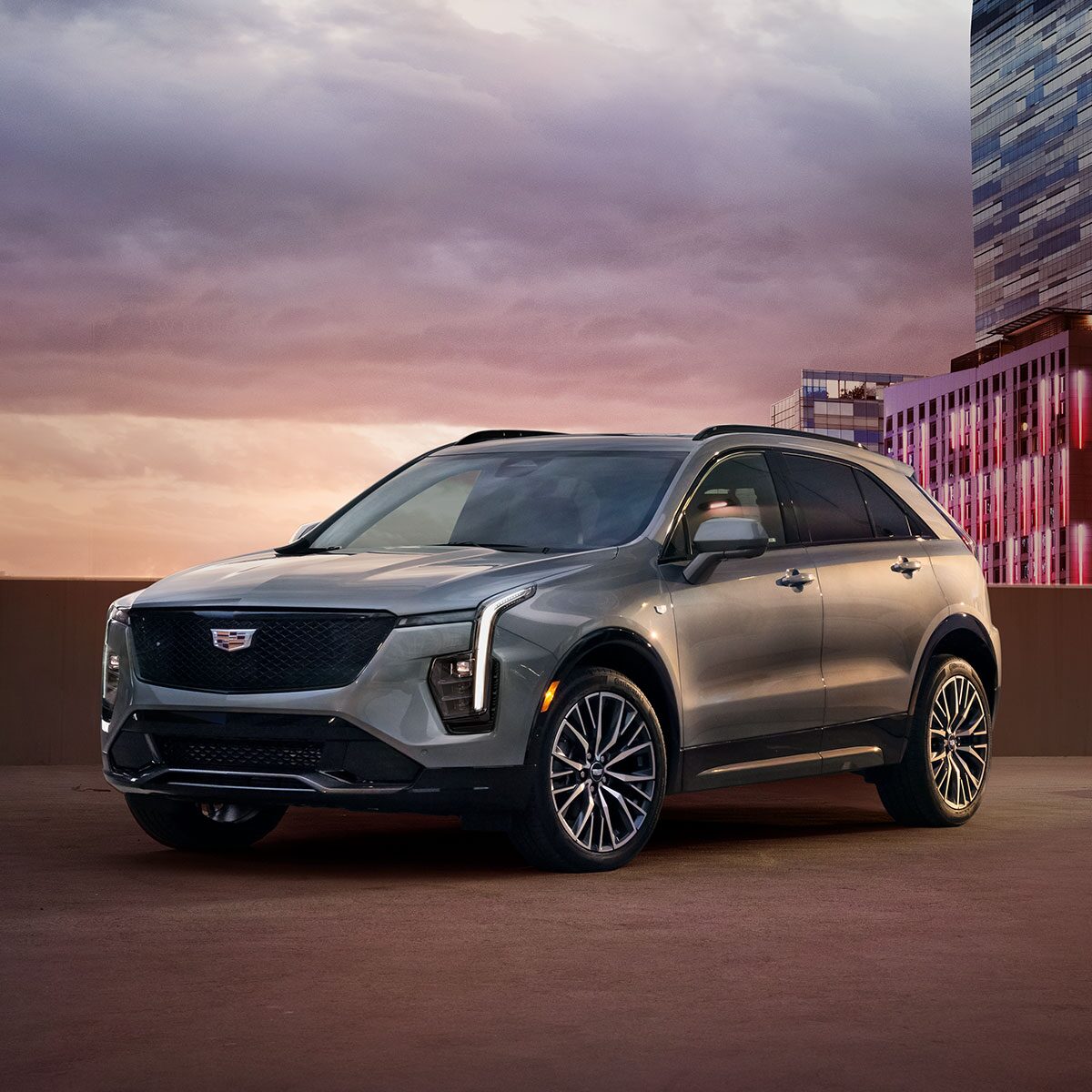 Front Side View of the 2025 Cadillac XT4 Parked on Top Parking Garage Level in the City