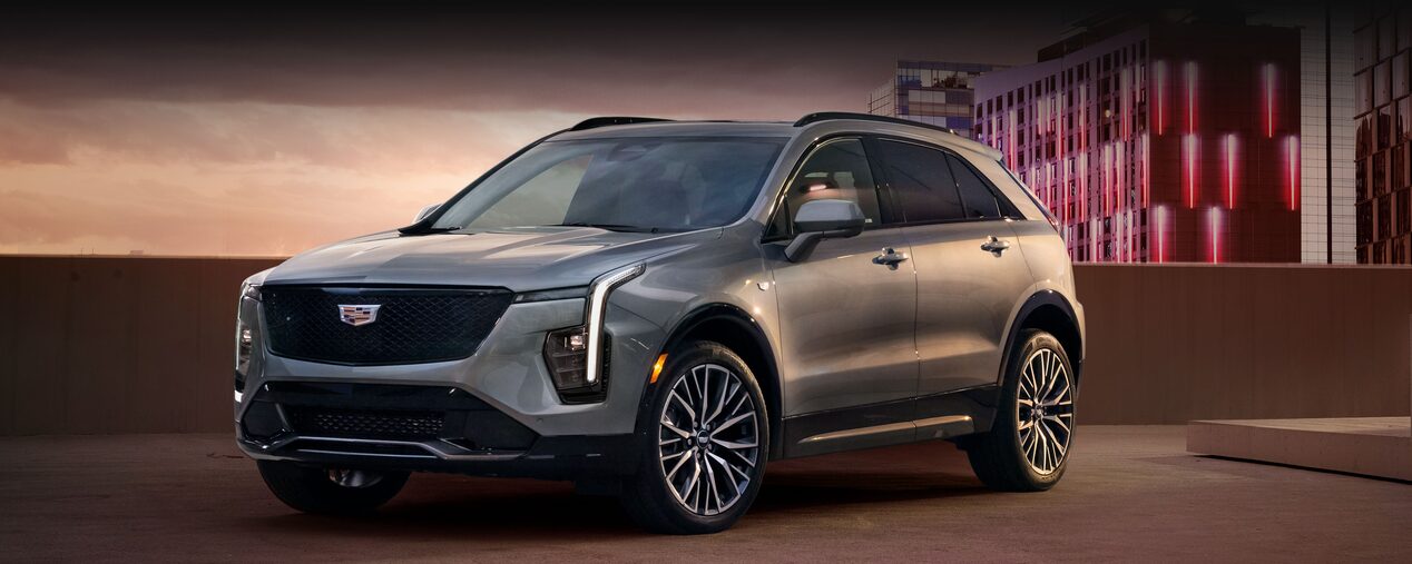 Front Side View of the 2025 Cadillac XT4 Parked on Top Parking Garage Level in the City