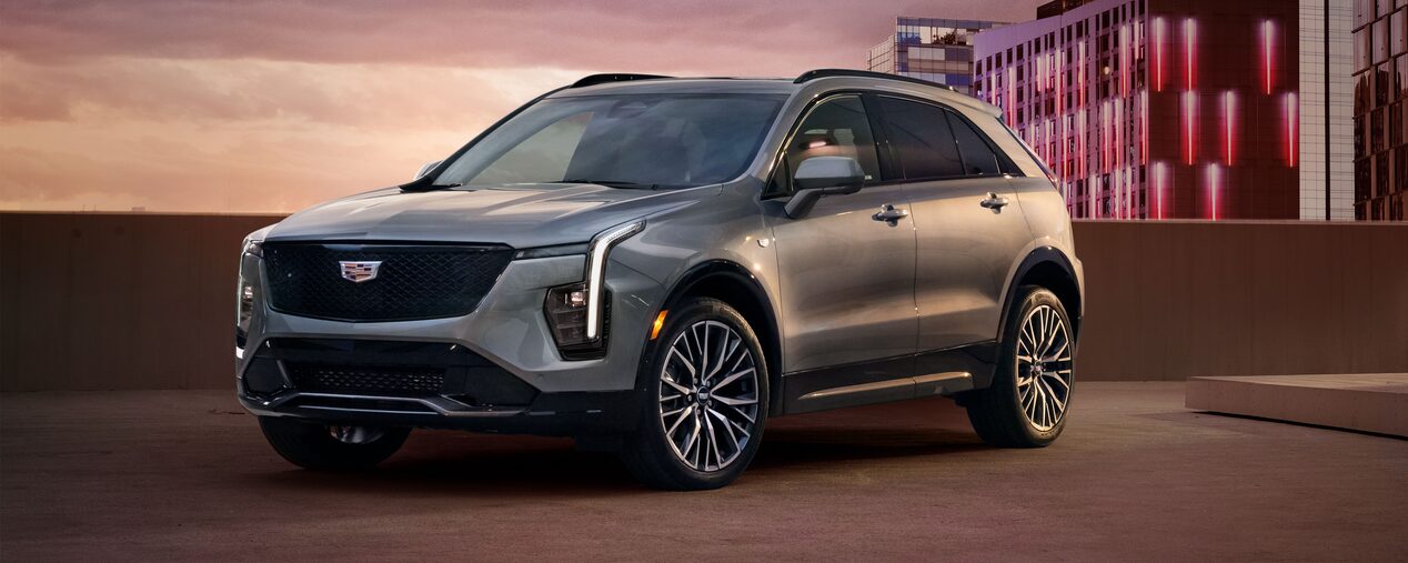 Front Side View of the 2025 Cadillac XT4 Parked on Top Parking Garage Level in the City