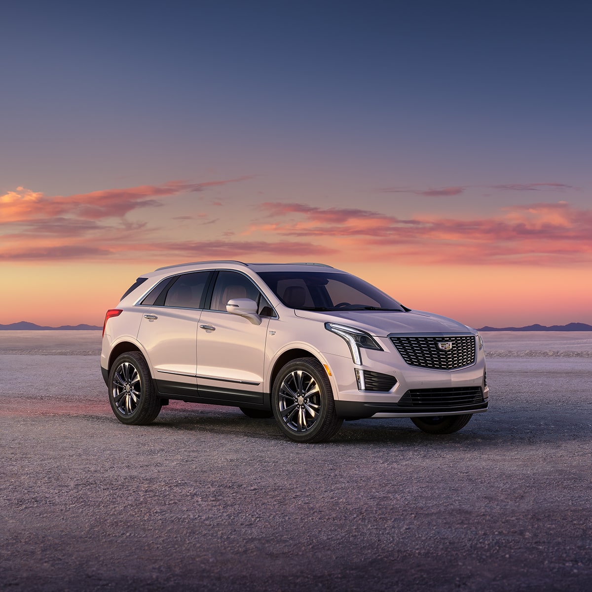 The Crystal White Tricoat Cadillac XT5 Parked During a Lovely Sunset in Desert