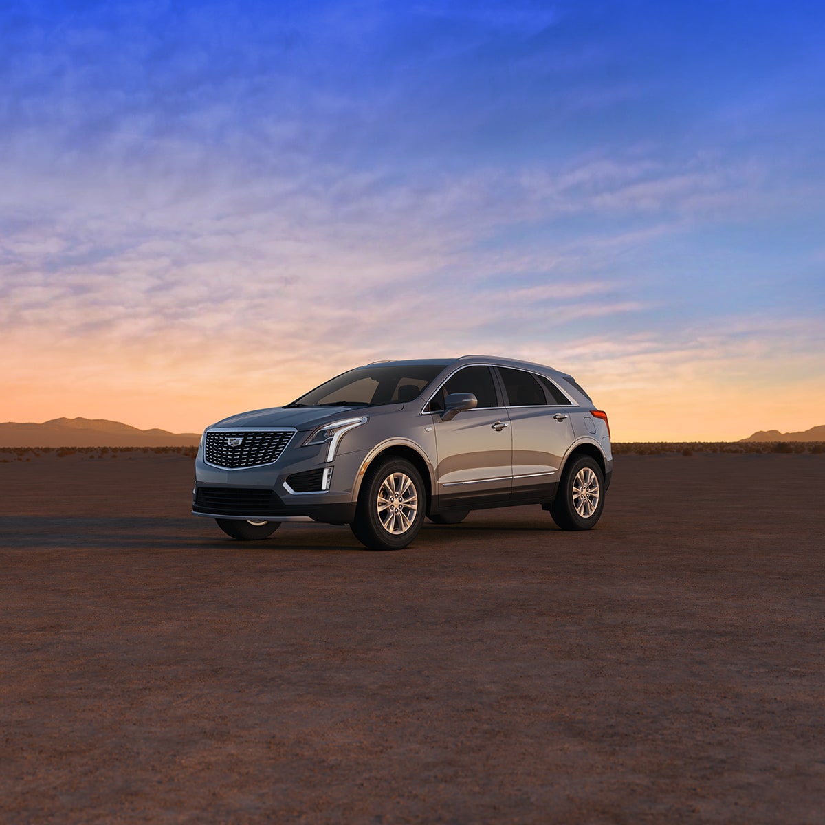 The Crystal White Tricoat Cadillac XT5 Parked During a Lovely Sunset