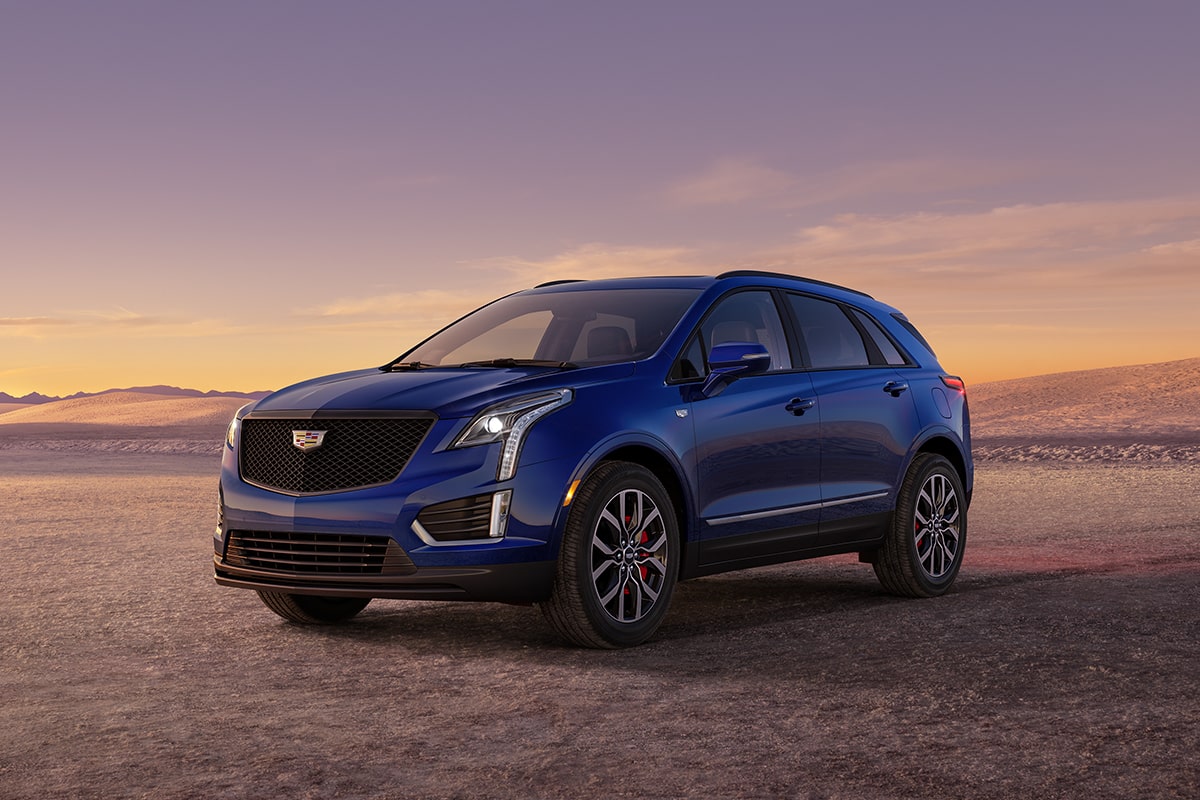 The Dark Moon Blue Metallic Cadillac XT5 Parked During the Sunset in Desert