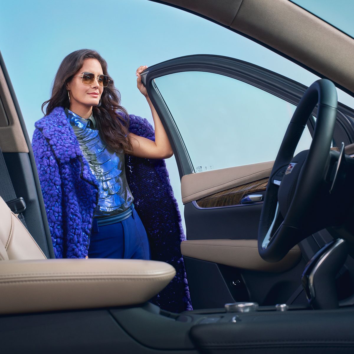 View from the Interior of a Woman Opening the Car Door of a Cadillac XT6