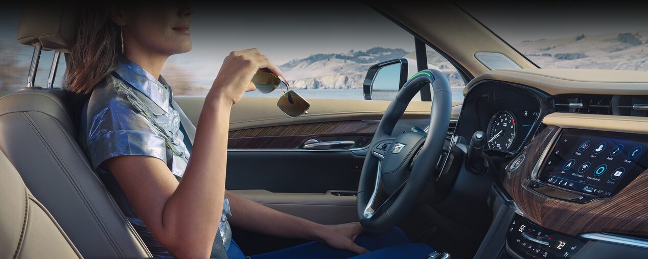 Driver's Perspective Shot of the Steering Wheel and Dashboard of a Cadillac XT6