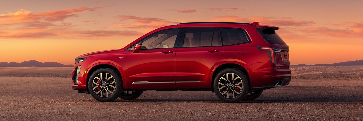 The Impressive Side Profile of Cadillac XT6 Parked in Open Desert During Sunset