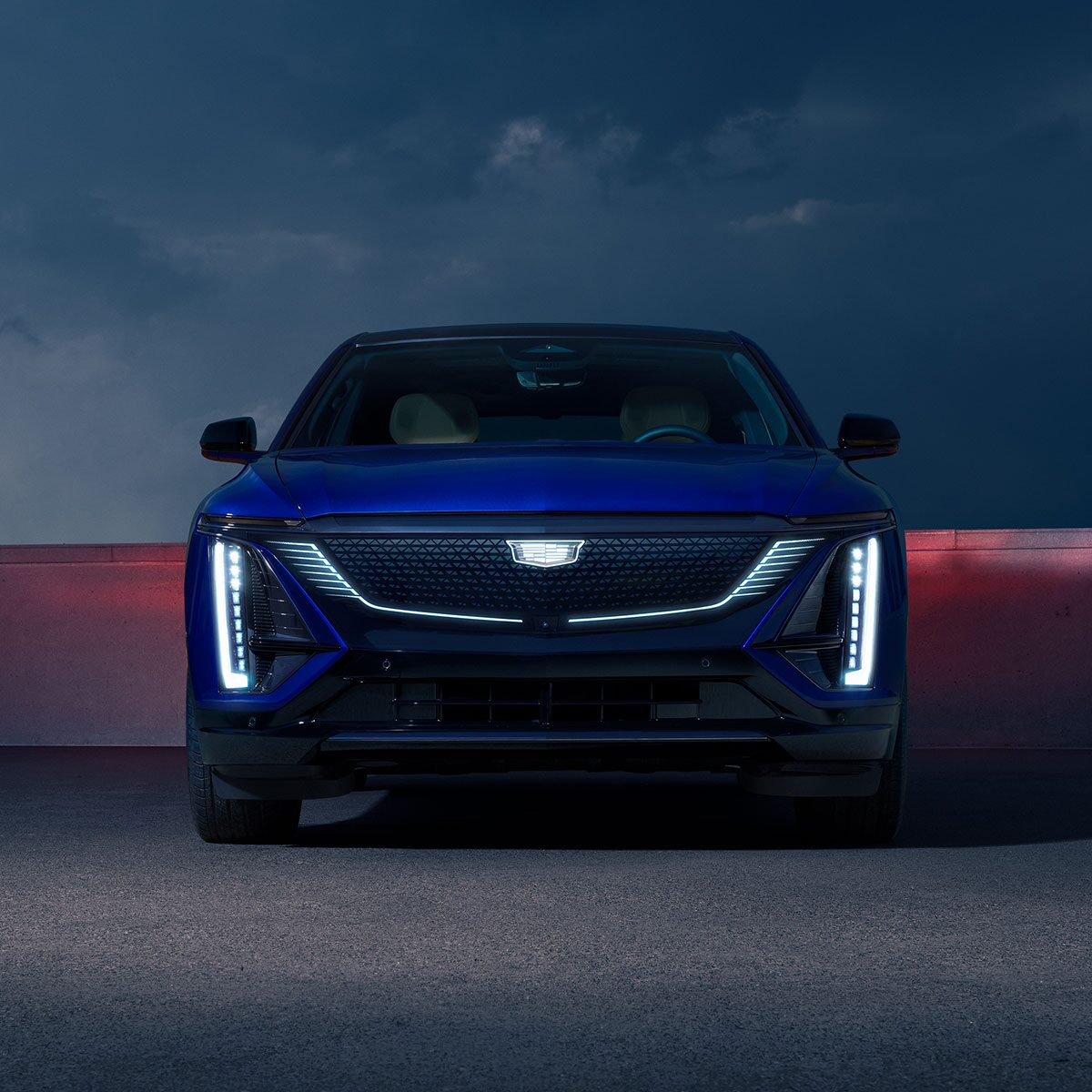 Front View of a Parked Blue 2025 Cadillac LYRIQ and Close-up on LED Slim Headlights