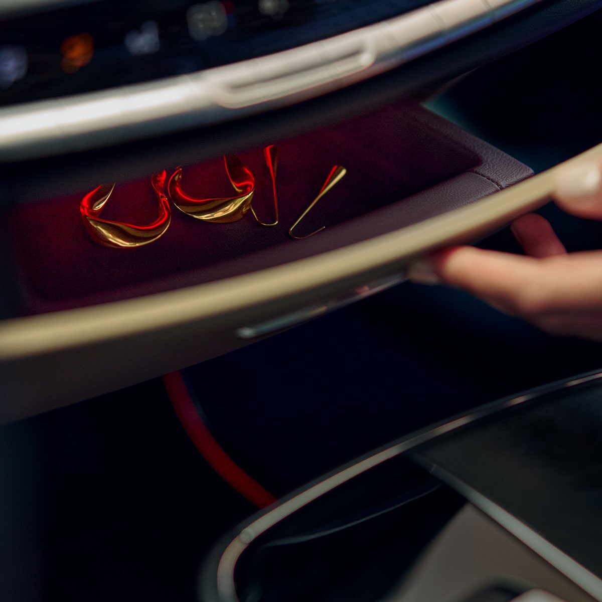 Close-up of Jewelry Inside of the 2025 Cadillac LYRIQ's Dashboard's Storage Drawer