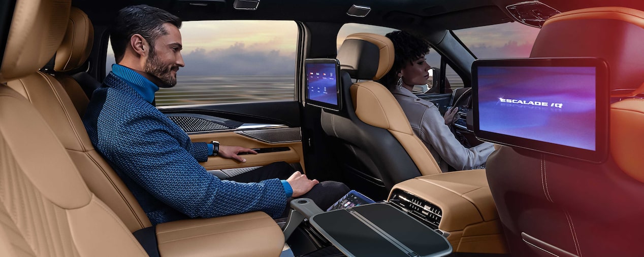 Man Smiling While Riding in the 2025 Cadillac ESCALADE IQ Executive Second Row