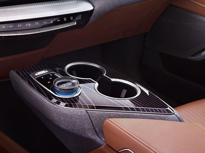 Close-up View of the 2025 Cadillac OPTIQ Sleek Center Console and Control Knob