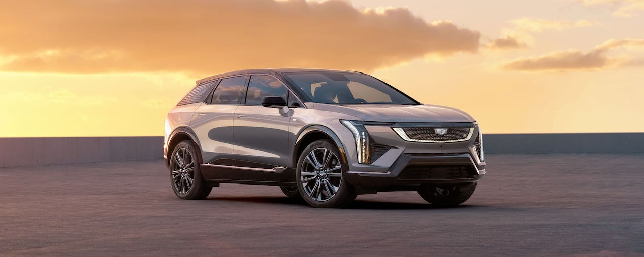Three Quarters View of a 2025 Cadillac OPTIQ Parked During a Beautiful Sunset