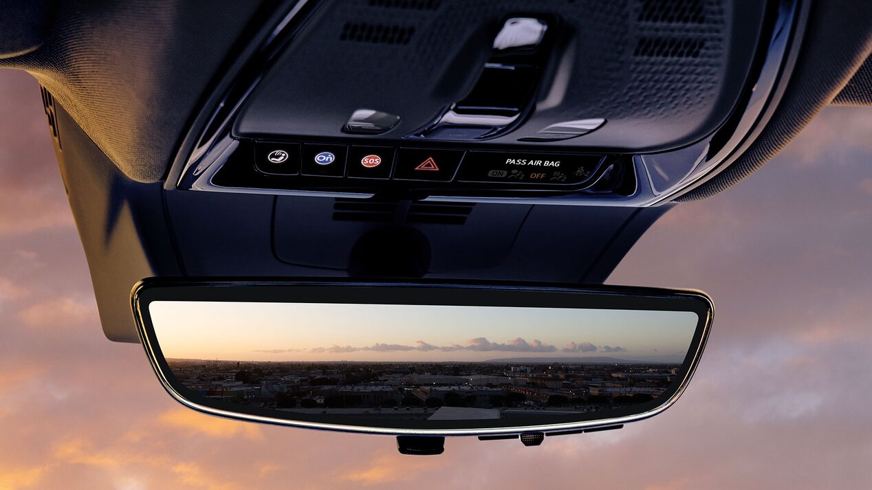 Close-up of the OnStar Button by the Cadillac OPTIQ's Rear View Mirror