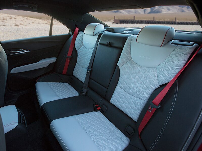 The 2025 CT4-V Backseat with Racing Inspired Seating and Torch Red Seatbelts