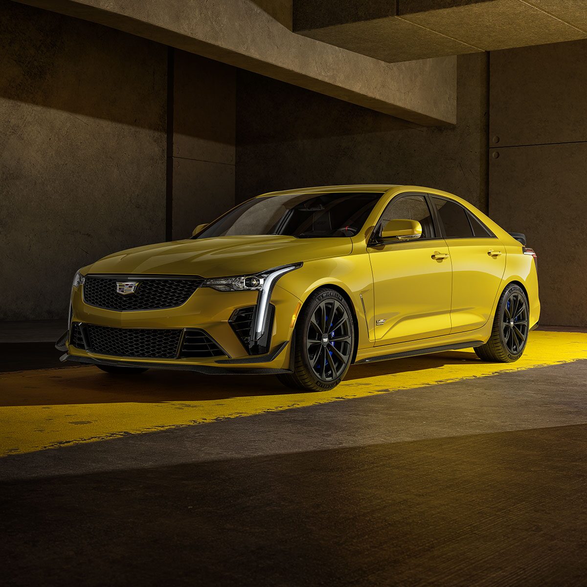 Three Quarters View of a Yellow 2025 Cadillac CT4-V Parked in Parking Garage