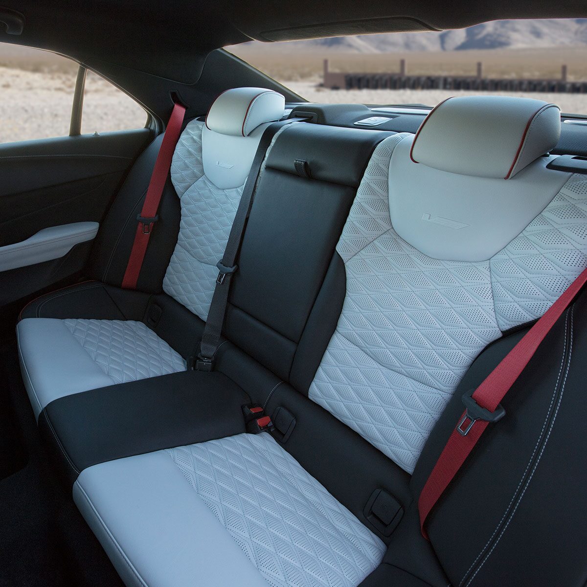 The 2025 CT4-V Backseat with Racing Inspired Seating and Torch Red Seatbelts