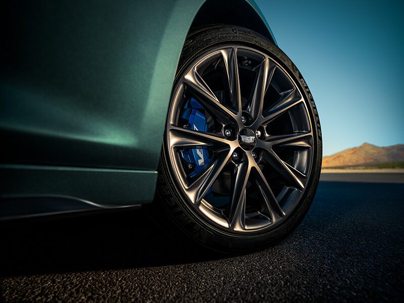 Low Angle View of a Front Tire Of a 2025 Cadillac CT5-V Driving Down the Road