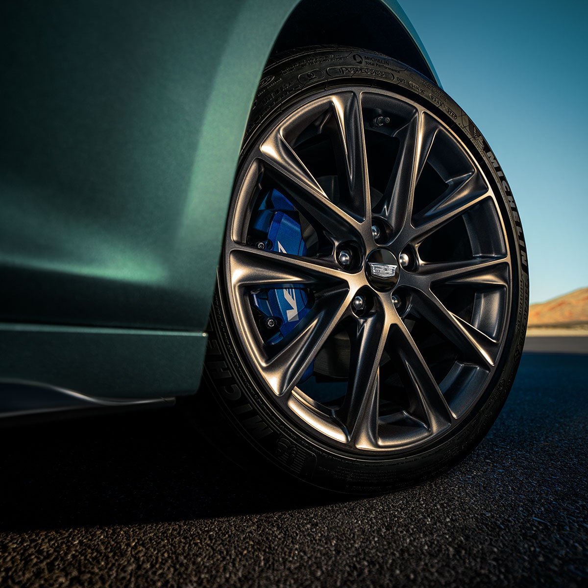 Low Angle View of a Front Tire Of a 2025 Cadillac CT5-V Driving Down the Road