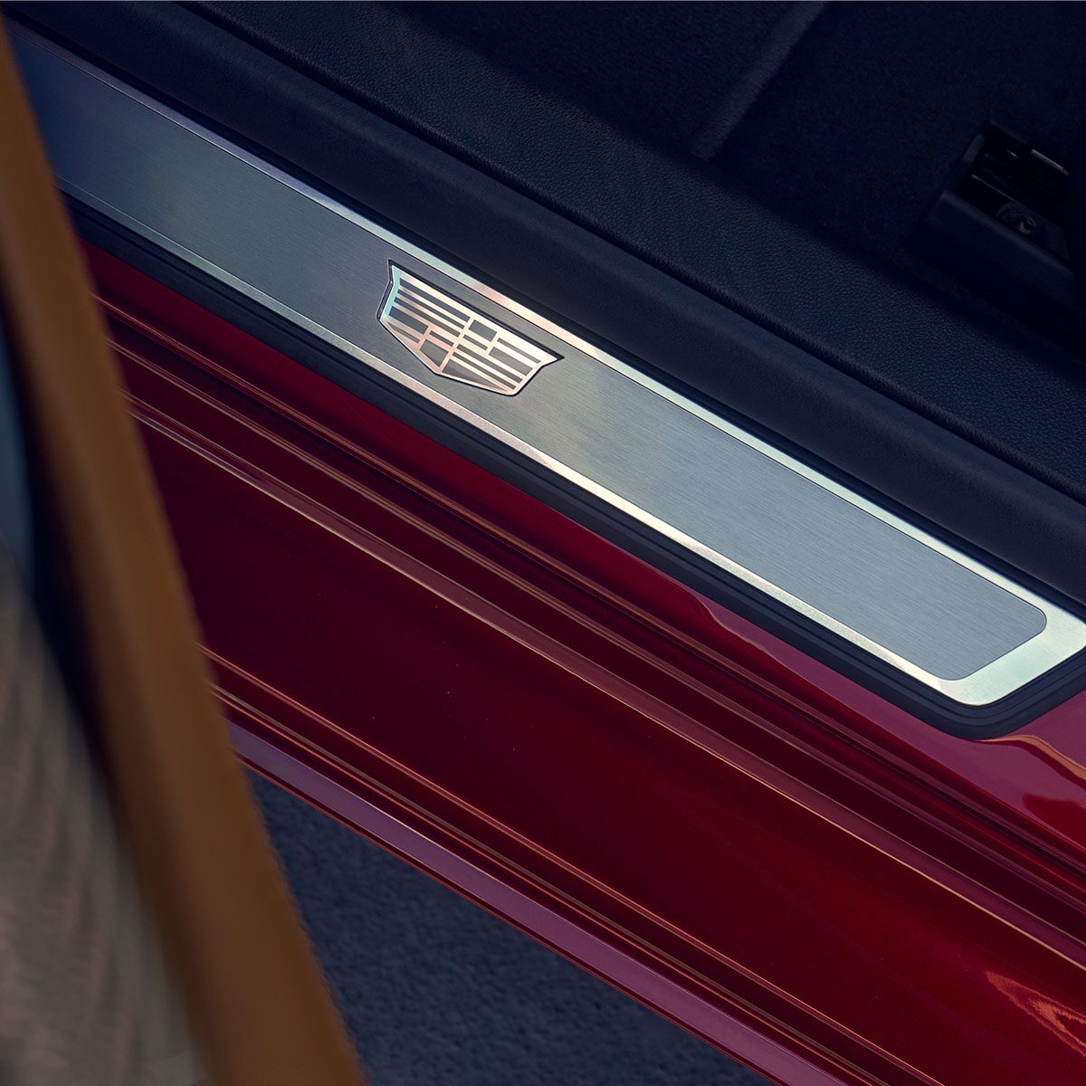 Close-Up View of the Crest Detail on the 2025 Cadillac CT5 Door Rocker Panel