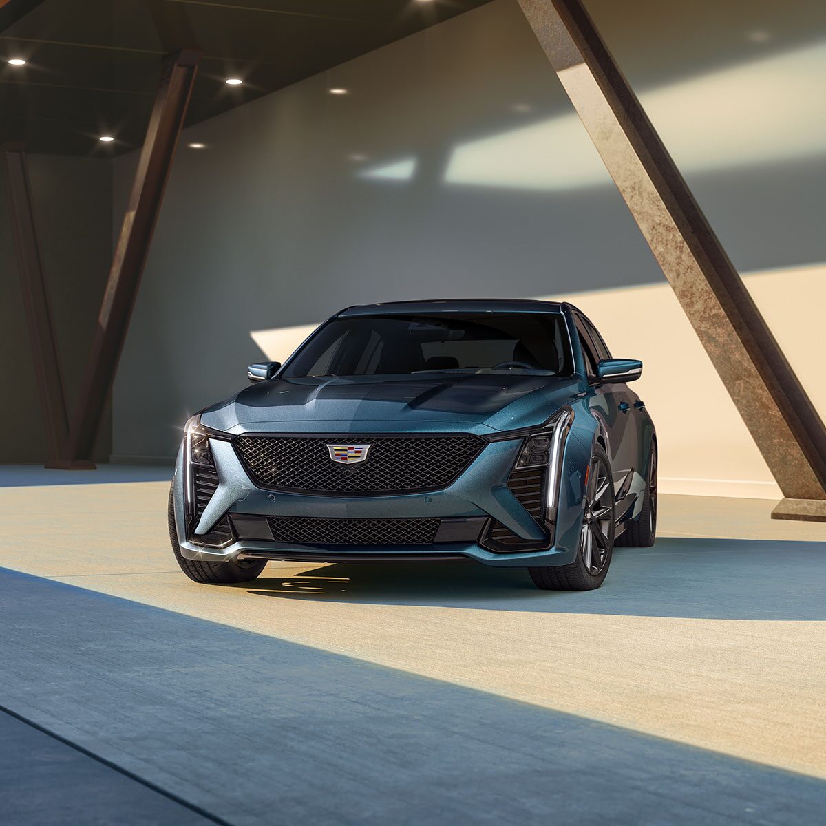 Front View of the Sleek 2025 Cadillac CT5 Sport Parked in Warehouse