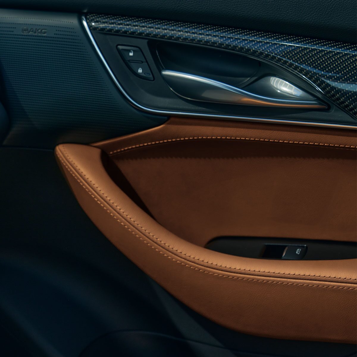 Close-Up View of the Tan and Jet Black Accents on Door Inside the 2025 Cadillac CT5