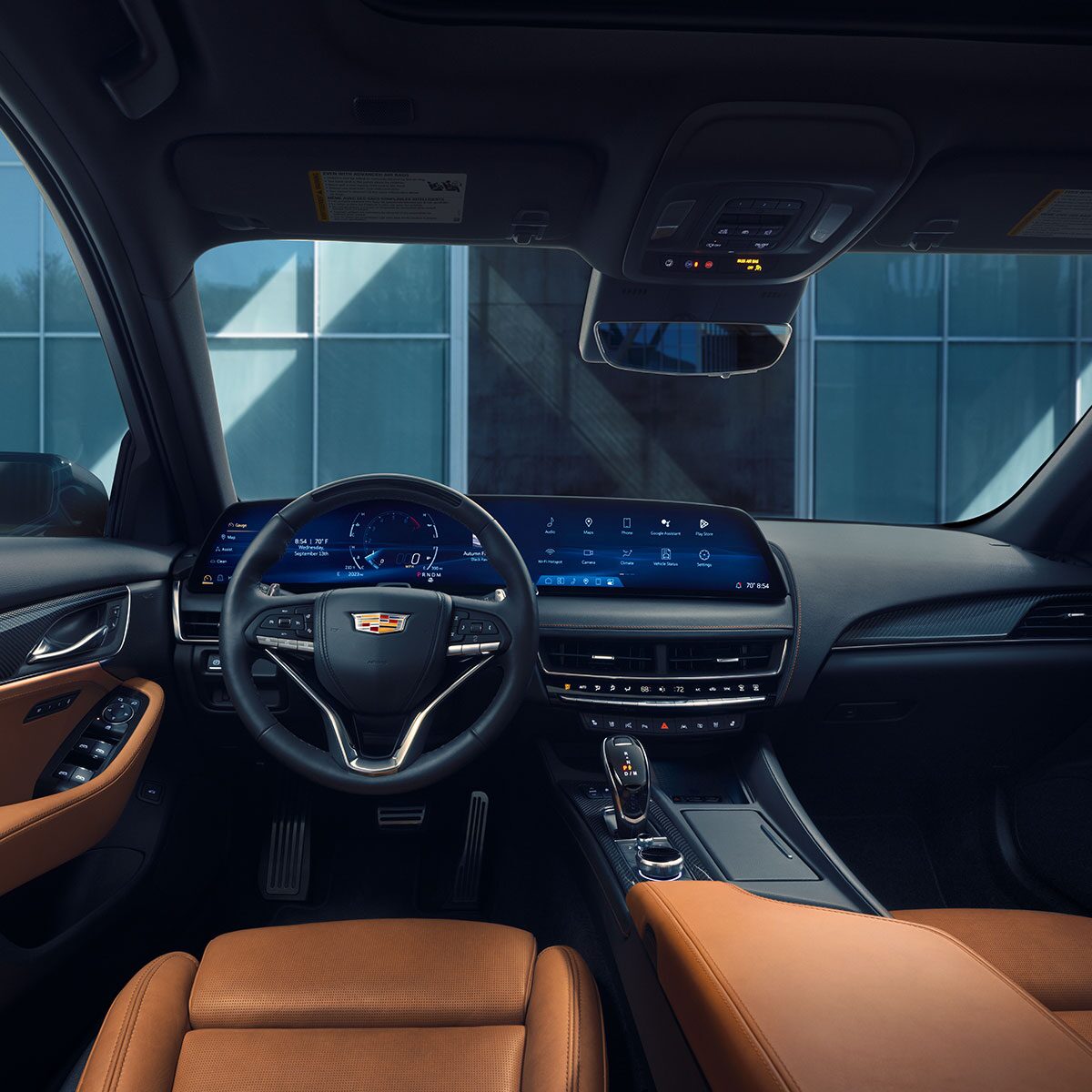 Driver's View of 2025 Cadillac CT5 Tan Leather Front Seats and LED Infotainment System
