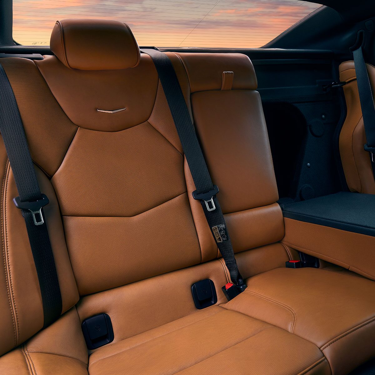 Sun Shining on 2025 Cadillac CT5 Crest on Front Leather Seats