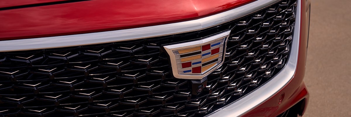 Sun Shining on 2025 Cadillac CT5 Crest on Front Leather Seats and View of Sun Roof