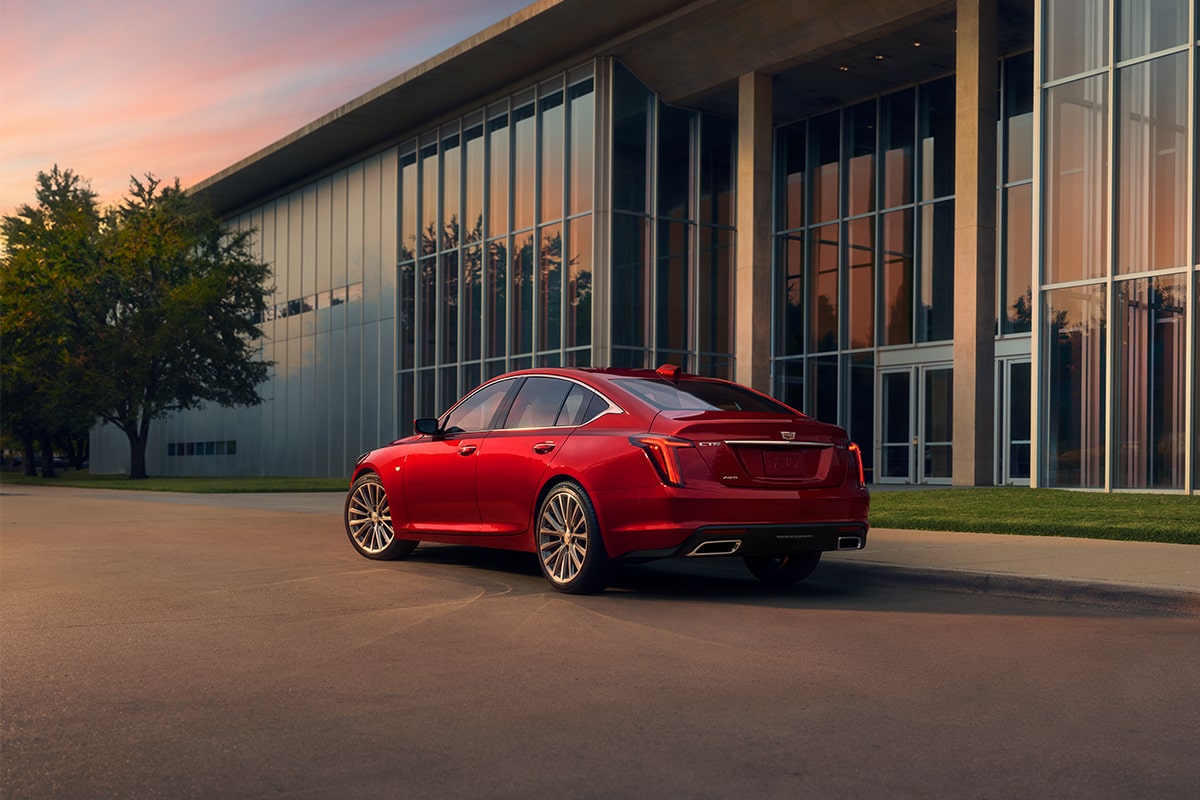 Sun Shining on 2025 Cadillac CT5 Crest on Front Leather Seats and View of Sun Roof