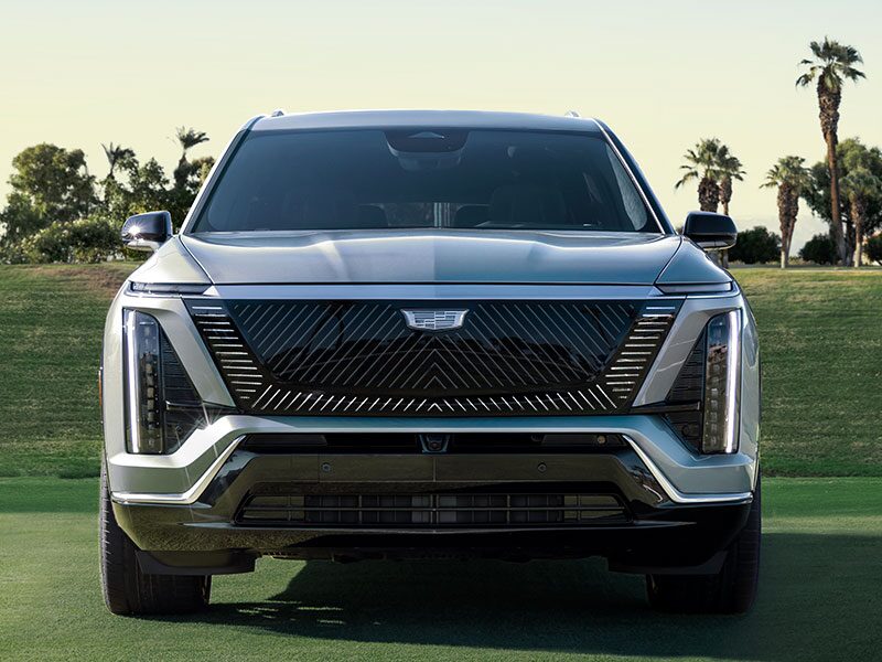 Front View of the 2026 VISTIQ Mid-size Electric SUV Parked on a Grassy Tennis Court