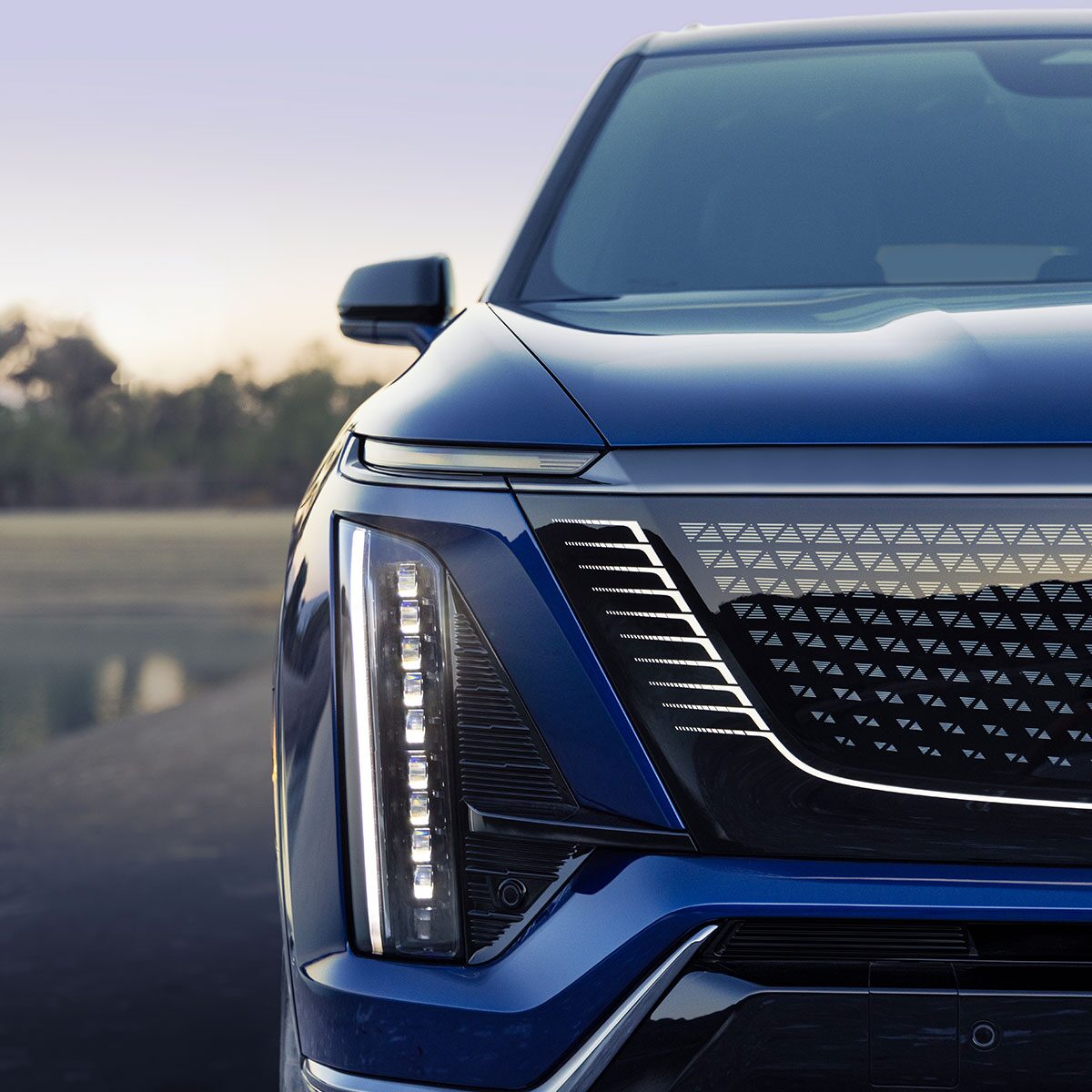 Close-up of the 2026 VISTIQ Luxury Electric SUV Grille and Passenger Side Headlamp