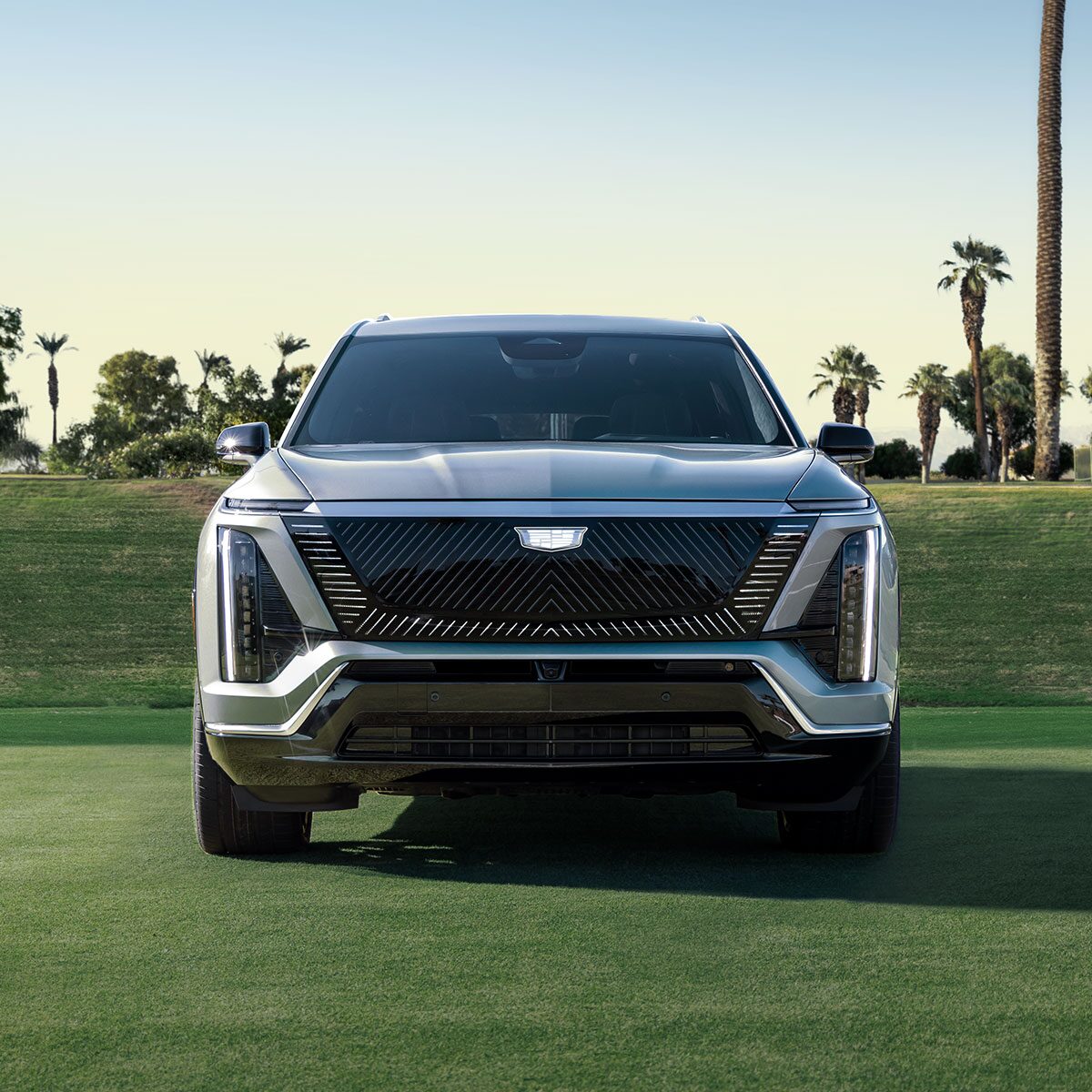 Front View of a 2026 VISTIQ Electric SUV Parked in a Grassy Tennis Court