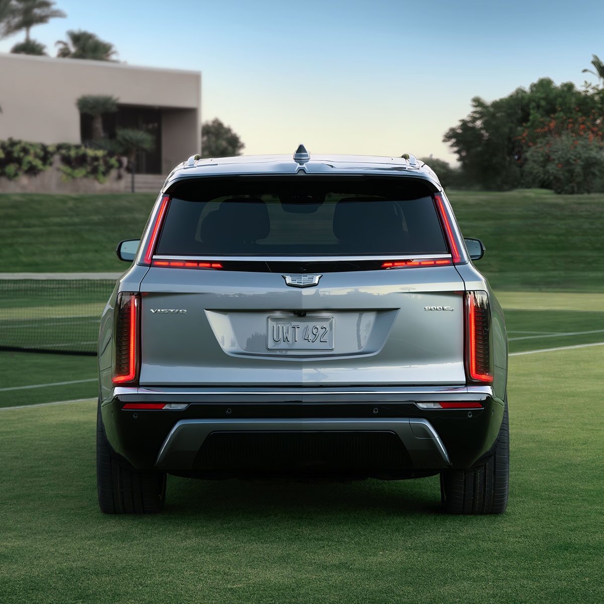 Rear View Shot of the 2026 VISTIQ Electric SUV Parked on a Grassy Tennis Court