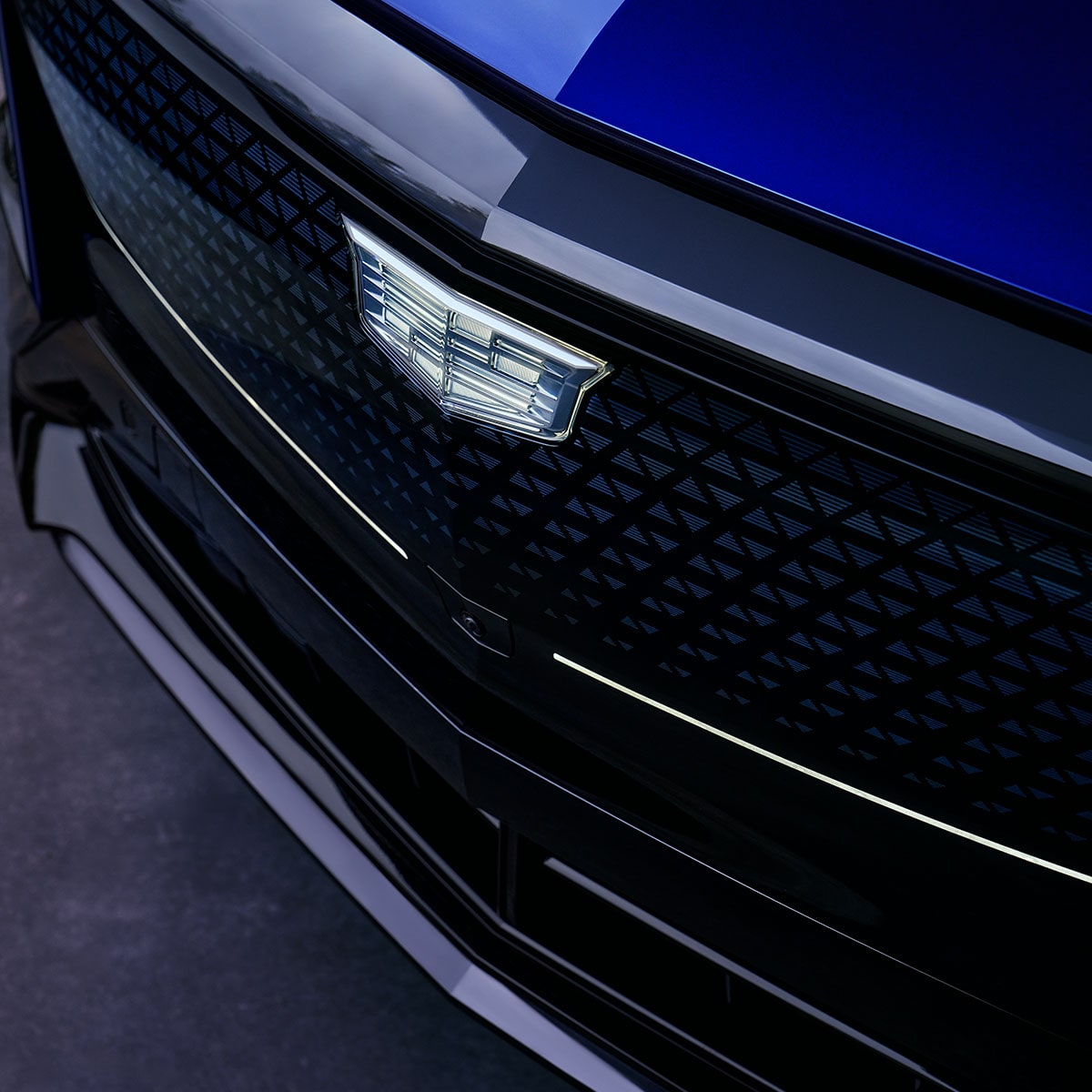 Close-up of the Crystal Shield Logo on the Cadillac LYRIQ EV SUV Grille