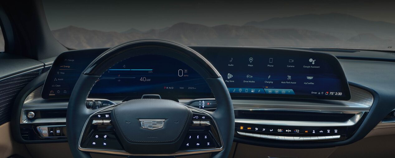 Close-up of a Woman Driving the Cadillac LYRIQ Steering Wheel and Driver's Dashboard