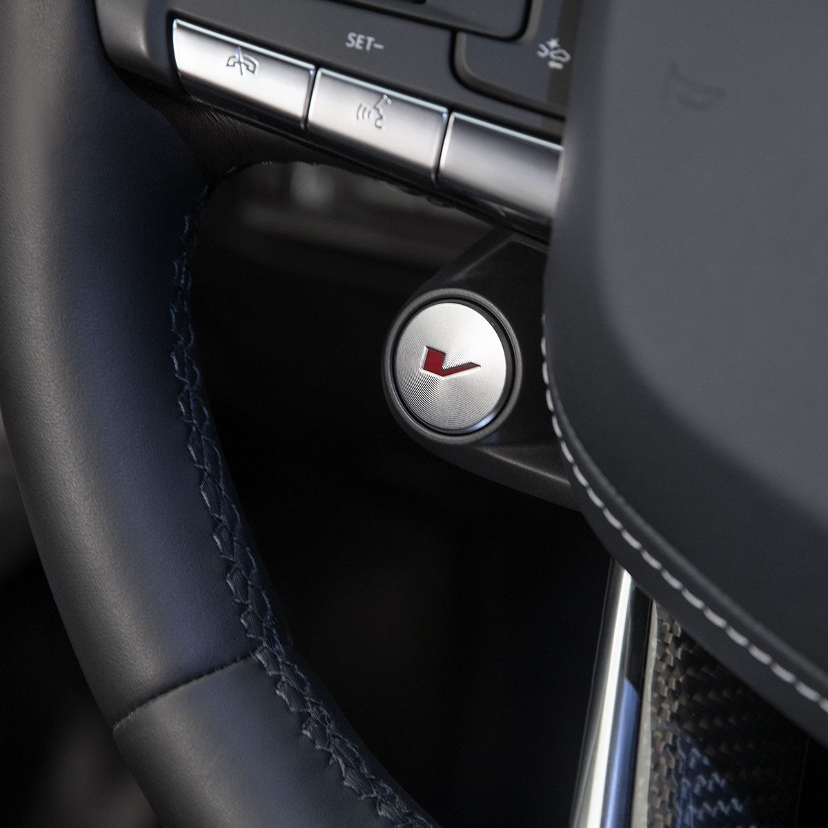 Close-up of the V Button on the Cadillac CT4-V Luxury Sport Sedan Steering Wheel