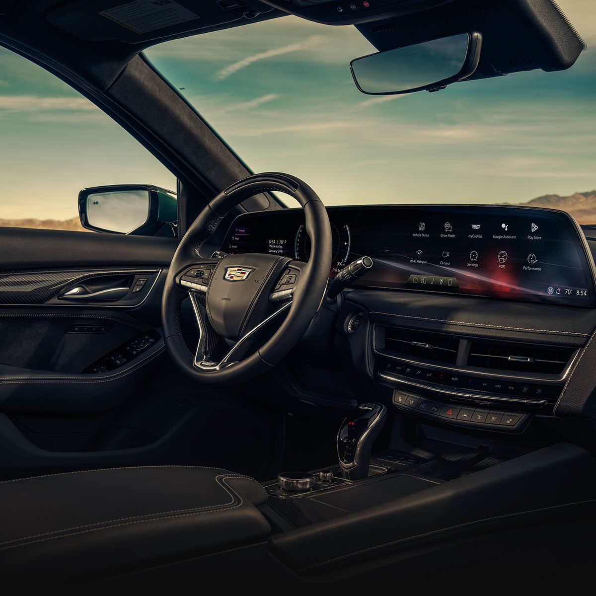 Front Passenger View of the  Cadillac CT5-V Interior Steering Wheel and Dashboard Under a Beautiful Sky