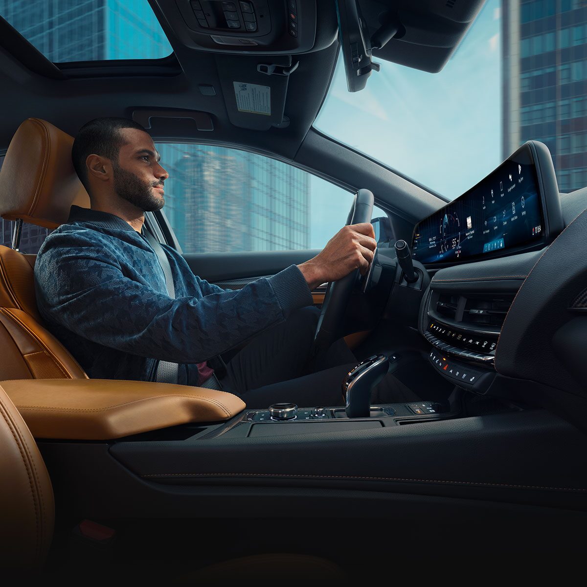 Passenger View of Man Driving a 2026 Cadillac CT5 Through the City