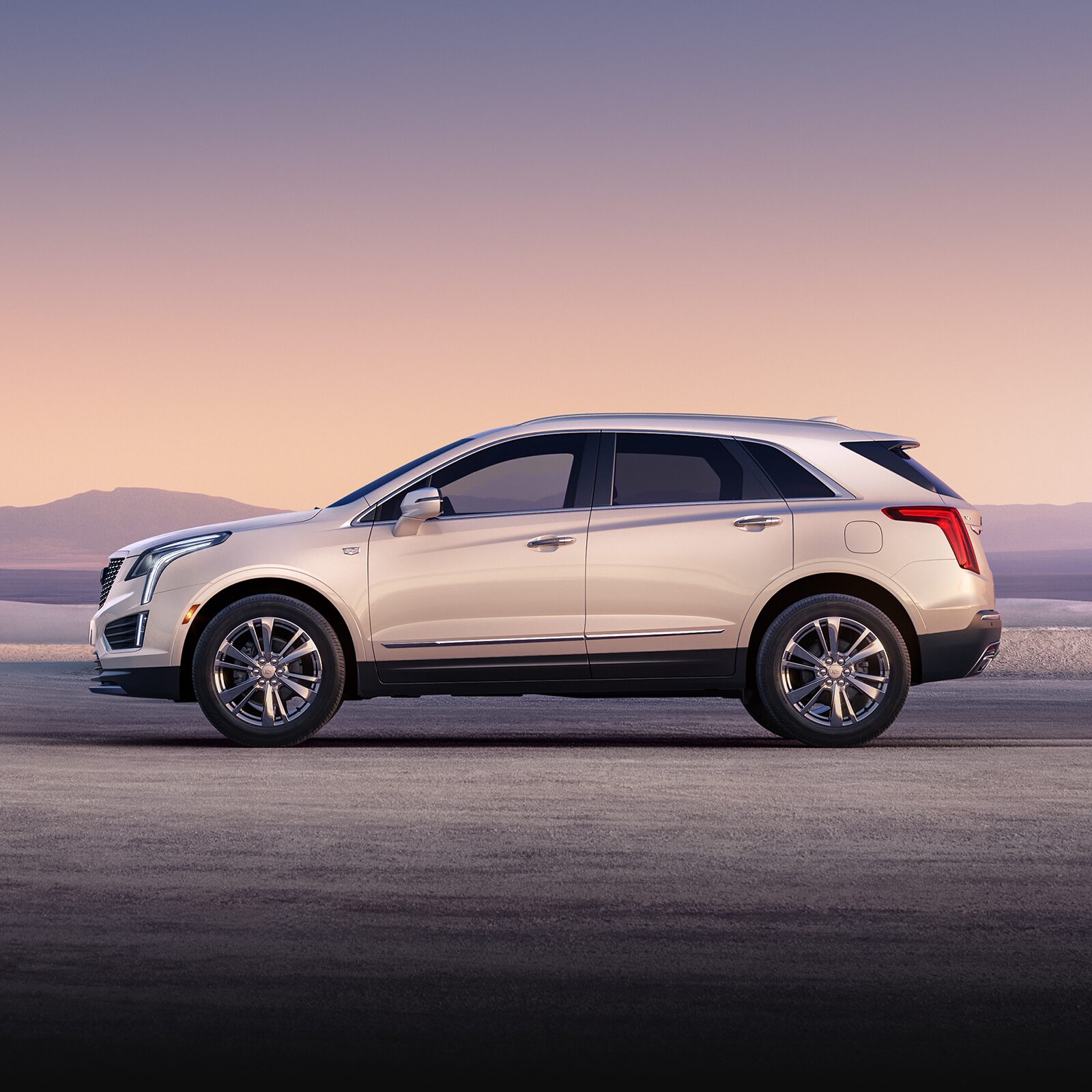 The Crystal White Tricoat Cadillac XT5 Parked During a Lovely Sunset