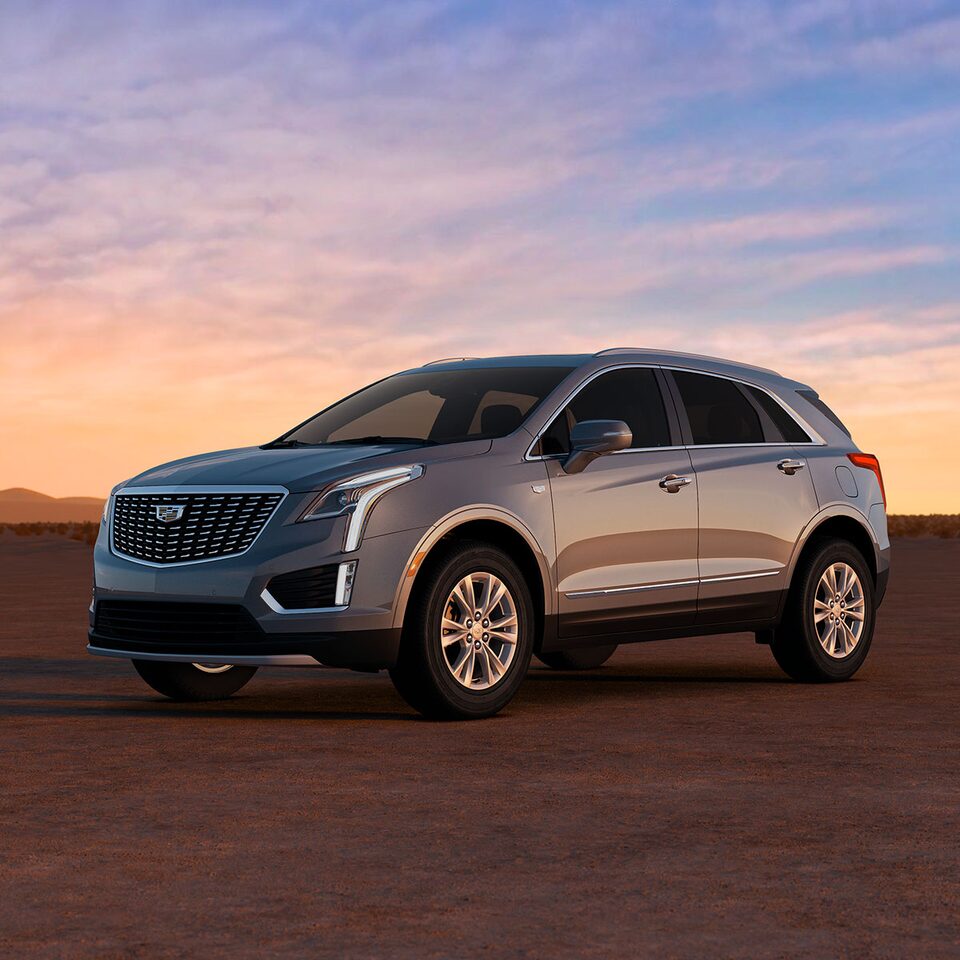 The Crystal White Tricoat Cadillac XT5 Parked During a Lovely Sunset