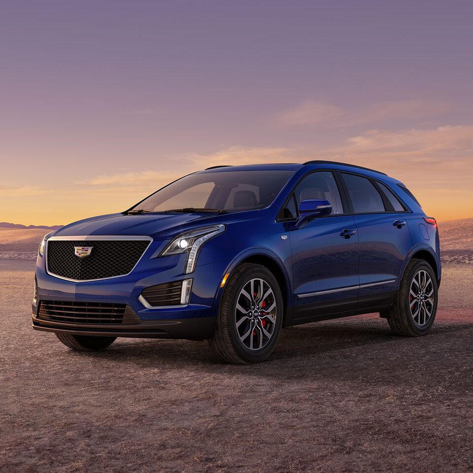 The Dark Moon Blue Metallic Cadillac XT5 Parked During the Sunset in Desert