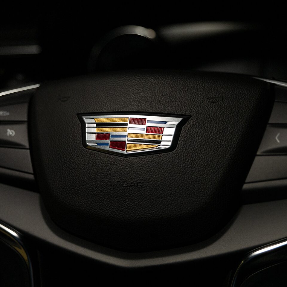 Close up of the Cadillac Logo on the 2026 XT5 Steering Wheel