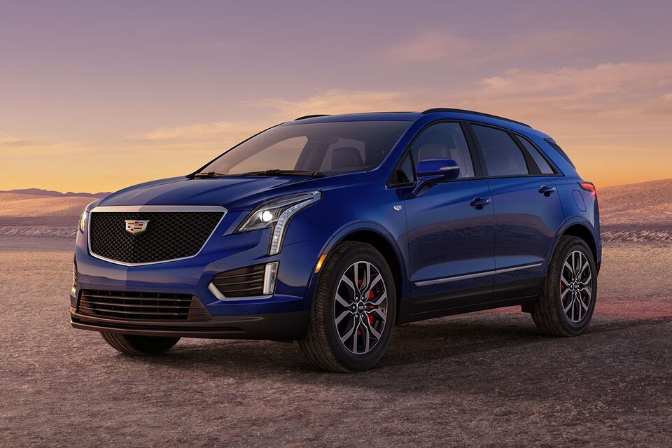 The Dark Moon Blue Metallic Cadillac XT5 Parked During the Sunset in Desert